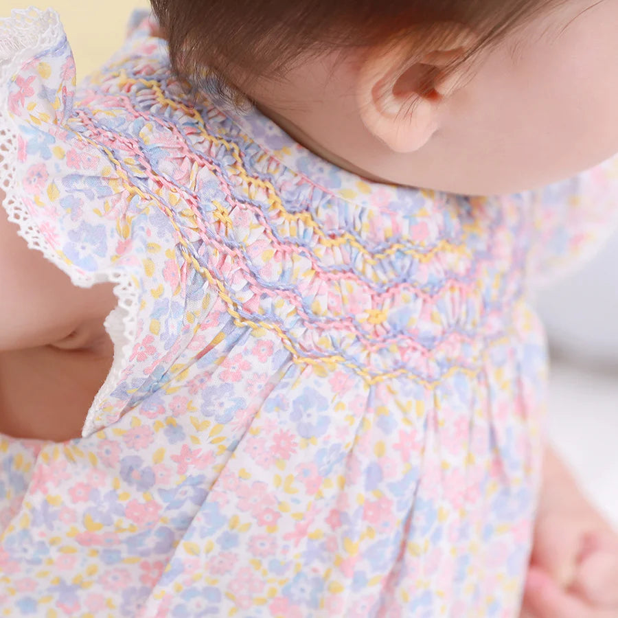 Jeanne Hand Smocked Raglan Romper